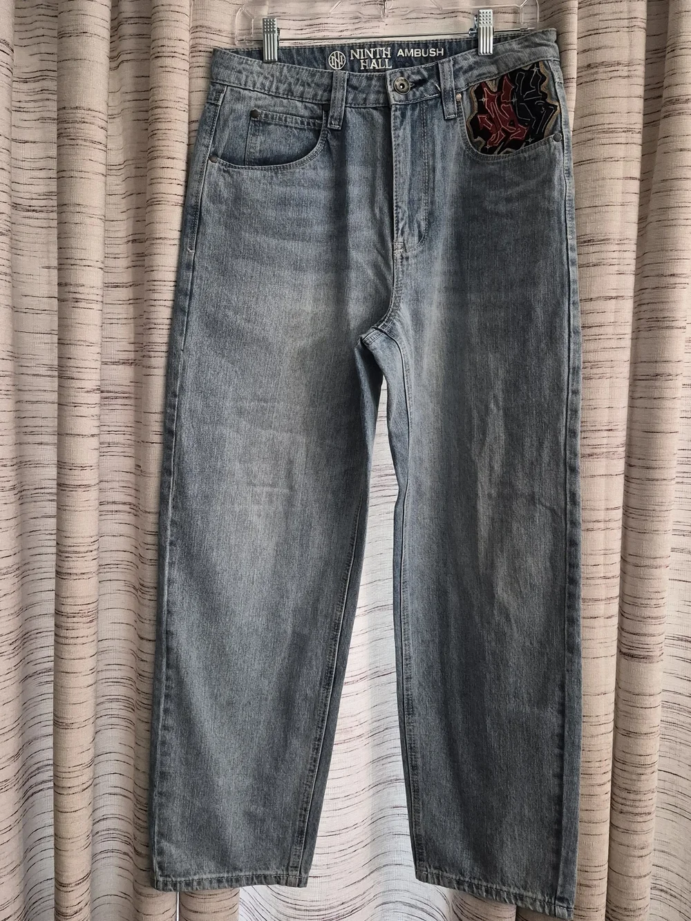 Light Blue Wash Loose Fit Men's Jeans with Embroidered Back Pockets
